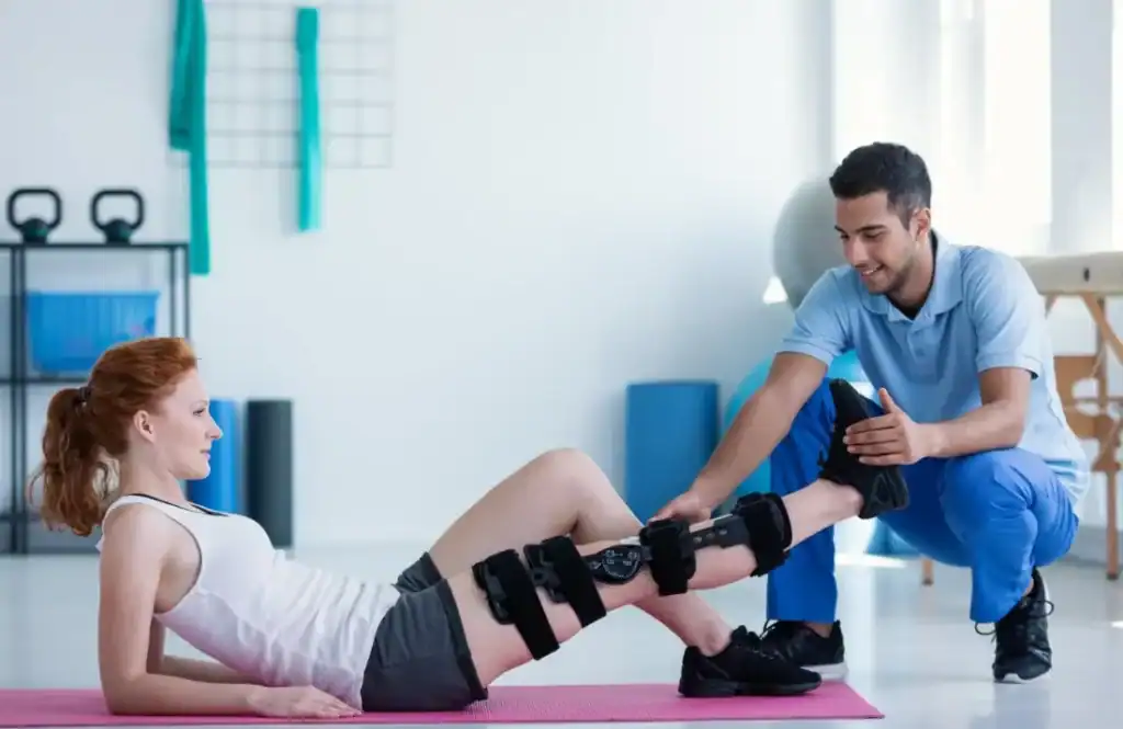 Woman having treatment to help muscle recovery Swindon after an injury